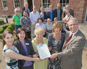 Volunteers, staff, the Mayor and ARA with the award